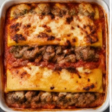 Illustrative polenta & sausage bake in a baking dish