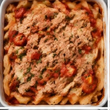 Illustrative tuna & tomato pasta bake in a baking dish